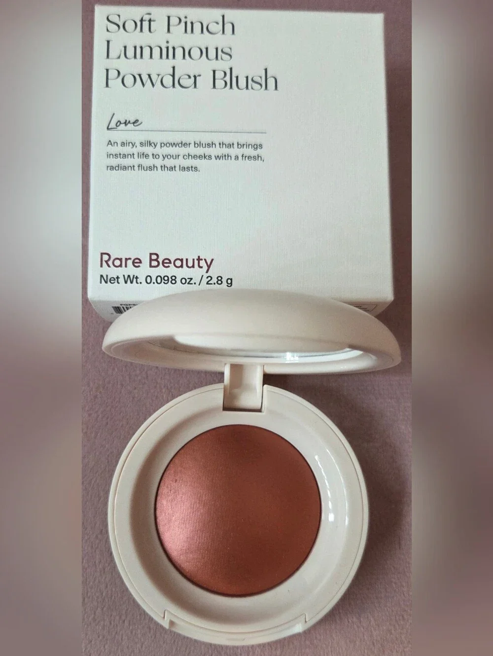 Rare Beauty blush in warm copper-rose